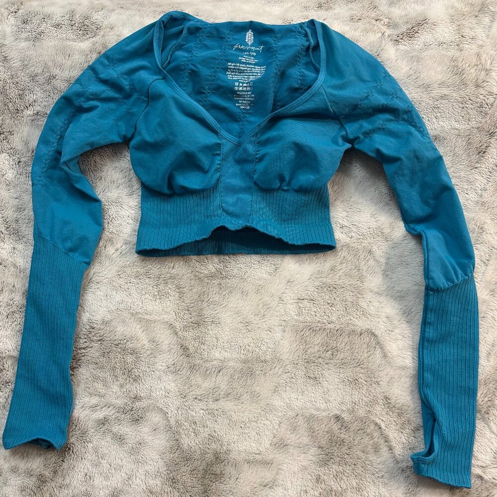 FP Movement “Good Karma cropped long sleeve layer” Blue Crop Top